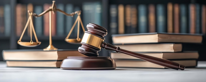 Detailed shot of a gavel with law books