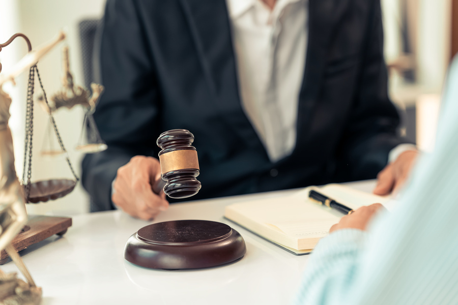 personal injury lawyer with client in office