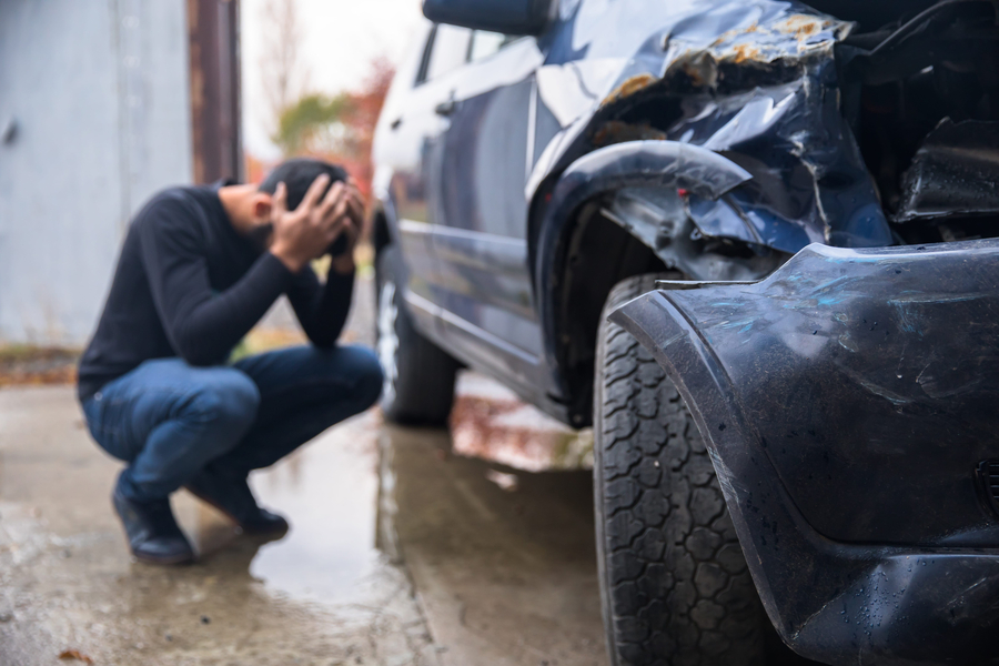sad man and car crash accident