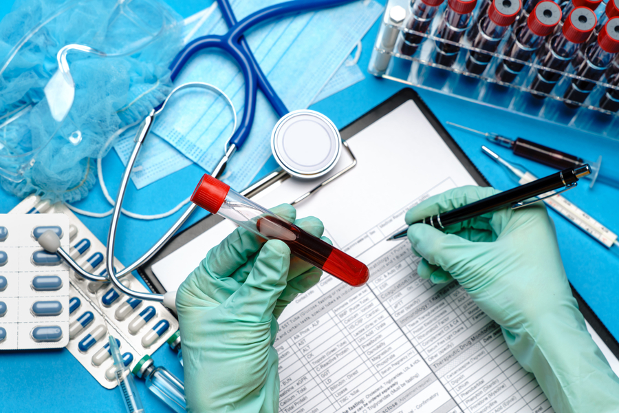 lab technician in gloves working on DUI blood test